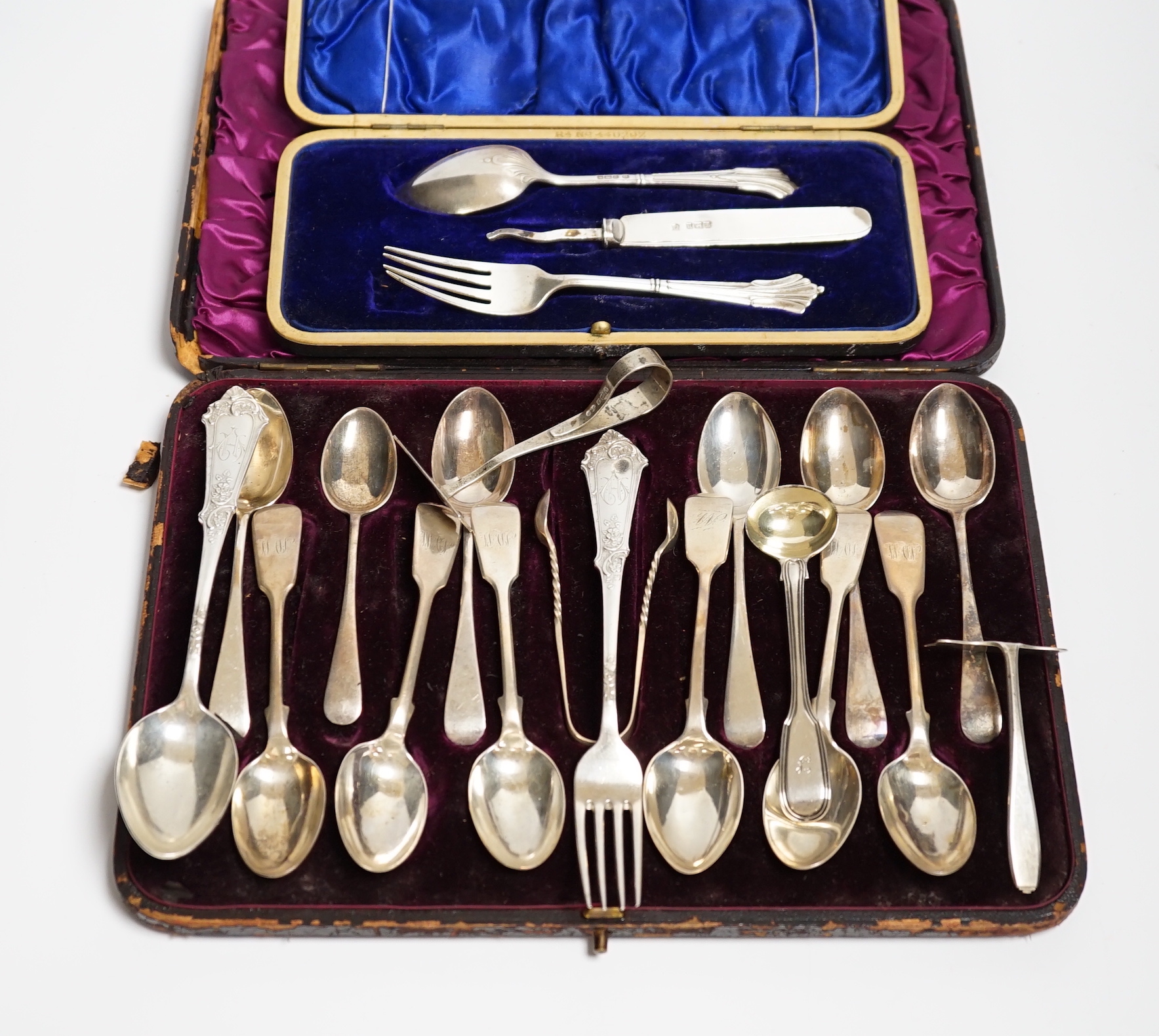 Two sets of six silver teaspoons, fiddle and Old English pattern and other silver or 900 flatware including a cased Christening trio (a.f.).